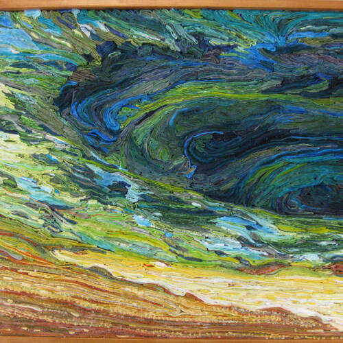 Landscape of an area of Yellowstone created from many layers of textiles. Colors range from blue, to green and into shades of yellow and brown.